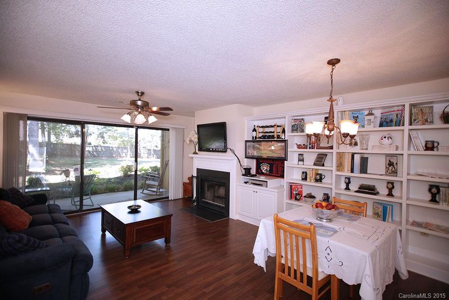 This Lake Norman Waterfront community is the Hidden gem of Cornelius! Your building is in a great location just a stroll to the Lake with a great garden back yard that you can walk from your full length patio. Excellent floor plan with laminate wood flooring thru out. One of the only units that has built in shelving.  Day dock on Lake and boat and Kayak storage and a swimming pool. Hoa dues covers exterior maintenance ,landscaping,all Water, and trash service. Just steps away from Harris Teeter.