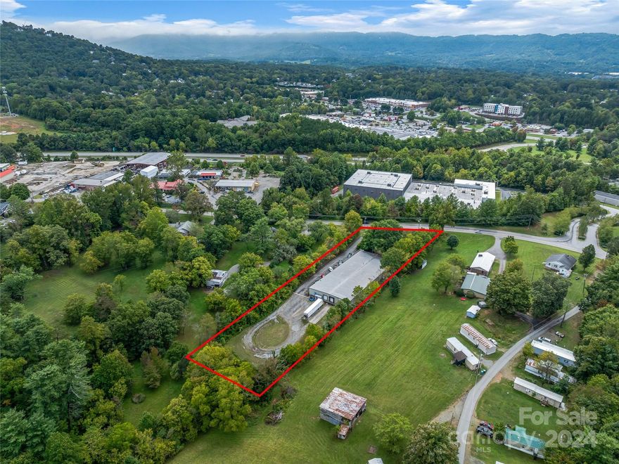 Fully leased manufacturing/warehouse building offered as a incredible passive income investment. The 14,970 SF building has three private offices, a built-in reception window, conference room and break room. The property includes a clean room with designated HVAC and air purification systems in addition to a loading dock with 8' and 7'5" doors. Conveniently located one minute from I-26/US-70 intersection and less than 15 minutes to I-240 and Downtown Asheville. Tenant is in place through May 2026 with option to renew. DO NOT DISTURB TENANT. SHOWING BY APPOINTMENT ONLY.