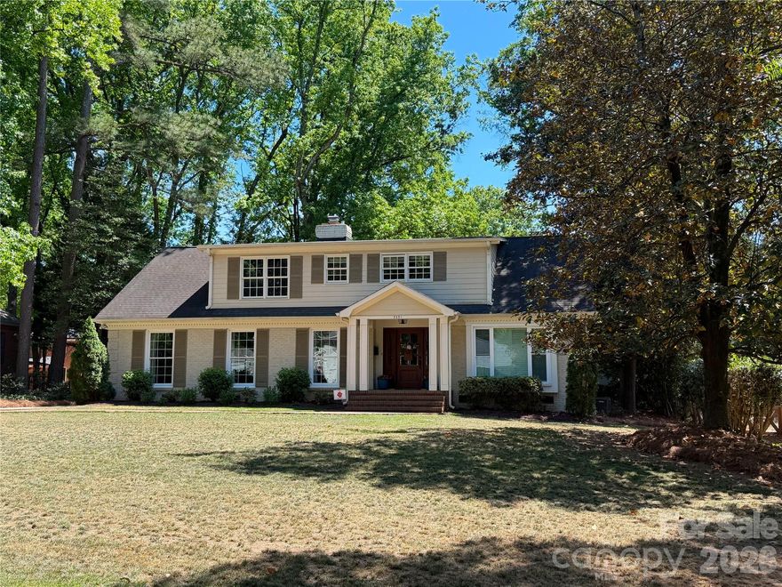 Thoughtfully reimagined for modern living, this SouthPark gem blends timeless charm with everyday functionality! This stunning 1.5-story brick home in SouthPark’s highly sought-after Beverly Woods East neighborhood sits on a beautiful level .39-acre lot.  Originally a 2,500 sq ft ranch, the home was thoughtfully transformed (taken down to the studs including new roof, electrical panel, HVAC + endless interior cosmetic updates) prior to 2016 move-in. This 4-5 bedroom, 2.5-bath residence is now offering 3,190 sq ft. Designed in collaboration with an architect, the floor plan maximizes natural light and flows effortlessly for both everyday living and entertaining.  The spacious kitchen, complete with walk-in pantry, abundant cabinetry, granite countertops, and an oversized island with breakfast bar, opens seamlessly to the den with fireplace. A convenient laundry room with drop zone is located just off the kitchen. The main-level primary suite is privately situated at the rear of the home and features a fully renovated bath. A dedicated home office near the front entry provides an ideal space for remote work.  Upstairs, you’ll find 3 additional bedrooms and 1 updated full bath plus additional bonus/flex/bedroom currently used as an exercise room.  There is also unfinished space off front left bedroom that is already plumbed for future homeowners' conversion to additional 3rd full bath.  The home has been meticulously maintained, featuring fresh neutral paint, gleaming hardwood floors, and all windows replaced.  Enjoy outdoor living on the inviting patio overlooking the expansive backyard, shaded by mature oak trees - perfect for relaxing or entertaining.  Beverly Woods East Swim Club is nearby - requires separate membership.   Live minutes from everything in SouthPark while enjoying the space, privacy, and comfort of this beautifully updated home.