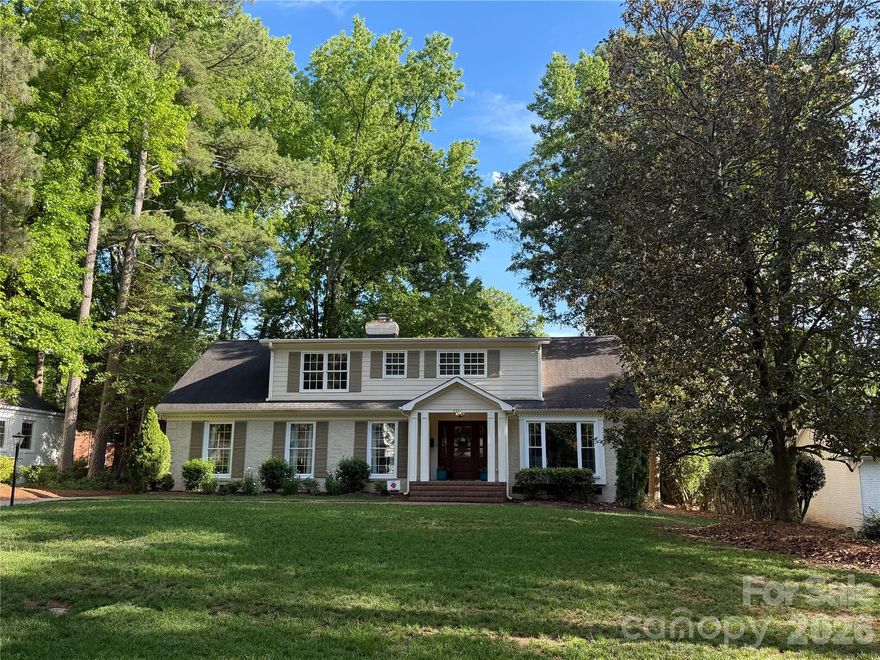Thoughtfully reimagined for modern living, this SouthPark gem blends timeless charm with everyday functionality! This stunning 1.5-story brick home in SouthPark’s highly sought-after Beverly Woods East neighborhood sits on a beautiful level .39-acre lot.  Originally a 2,500 sq ft ranch, the home was thoughtfully transformed (taken down to the studs including new roof, electrical panel, HVAC + endless interior cosmetic updates) prior to 2016 move-in. This 4-5 bedroom, 2.5-bath residence is now offering 3,190 sq ft. Designed in collaboration with an architect, the floor plan maximizes natural light and flows effortlessly for both everyday living and entertaining.  The spacious kitchen, complete with walk-in pantry, abundant cabinetry, granite countertops, and an oversized island with breakfast bar, opens seamlessly to the den with fireplace. A convenient laundry room with drop zone is located just off the kitchen. The main-level primary suite is privately situated at the rear of the home and features a fully renovated bath. A dedicated home office near the front entry provides an ideal space for remote work.  Upstairs, you’ll find 3 additional bedrooms and 1 updated full bath plus additional bonus/flex/bedroom currently used as an exercise room.  There is also unfinished space off front left bedroom that is already plumbed for future homeowners' conversion to additional 3rd full bath.  The home has been meticulously maintained, featuring fresh neutral paint, gleaming hardwood floors, and all windows replaced.  Enjoy outdoor living on the inviting patio overlooking the expansive backyard, shaded by mature oak trees - perfect for relaxing or entertaining.  Beverly Woods East Swim Club is nearby - requires separate membership.   Live minutes from everything in SouthPark while enjoying the space, privacy, and comfort of this beautifully updated home.