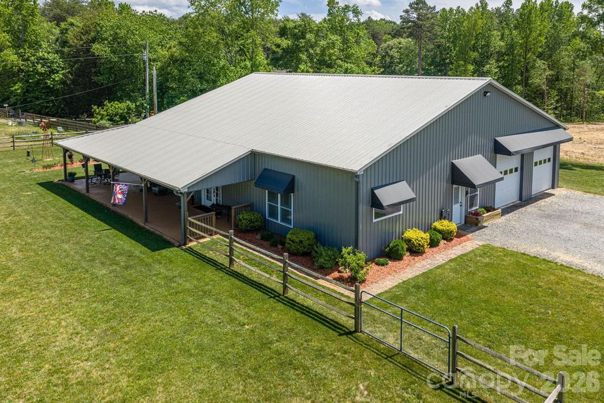 Welcome to this beautifully crafted stick-built barndominium in Maiden, NC—where modern comfort meets functional design on 2.68 acres. Offering 1,944 square feet of heated living space and an impressive 1,650 square foot garage, this property delivers the perfect blend of home and workspace.
Inside, you’ll find an open-concept layout with LVP flooring throughout, creating a seamless and low-maintenance living environment. The spacious kitchen is designed for both everyday living and entertaining, featuring a large island with bar seating, black stainless steel appliances, and a stylish tile backsplash. Ceiling heights range from 8’ to 15’, adding volume and character to the main living areas.
The home includes 2 bedrooms and 1.5 baths, highlighted by a walk-in shower and thoughtful finishes throughout.
The oversized garage is a standout feature with durable epoxy flooring and three 10’ garage doors—two in the front and one in the rear—offering excellent accessibility for vehicles, equipment, or hobby use.
Enjoy the outdoors from the wraparound covered porch, complete with freshly stained woodwork and porch flooring, all overlooking the peaceful 2.68-acre setting.
A rare opportunity to own a versatile and well-built property with space, style, and functionality—just minutes from town with a private, country feel.