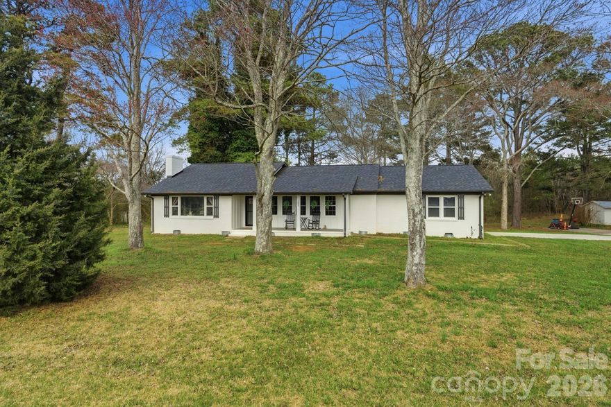 Gorgeous home nestled on nearly 1.5 acres, mature trees and no HOA. 3 large bedrooms, 3 beautiful bathrooms, and a flex room ideal for an office or bonus space. The large kitchen and eating area feature sliding doors leading to the deck and newly installed privacy fence in the backyard. A separate great room and den provide flexible living. Beautiful covered front porch, back deck and large yard are the perfect combination for outdoor living.  Enjoy fun evenings sitting by the firepit with friends and family.  A basement offers excellent storage!  York address and award-winning Clover School District. Whether you’re hosting, working from home, or just enjoying the quiet, this property fits the way you want to live. Age of the home is approximate. Roof 2022, HVAC 2022, Septic 2023. So much to love about this home, ask about all the upgrades!