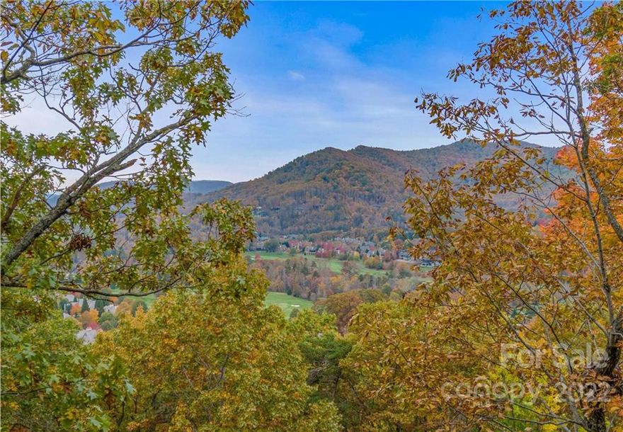 This 2.55 acre lot at over 2,500' elevation allows exceptional privacy with its views over the Jack Nicklaus Signature golf course and clubhouse.  The sunrises and sunsets afforded by the highly desirable south facing orientation with 180+ degree view lines are exceptional. The close proximity to the Clubhouse Village below is an added benefit.  The substantial boulder work at the top and bottom of the drive begin to frame a gorgeous entry and easier build site that will be perfect for a very special home.