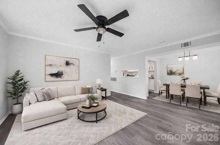 Welcome to this beautifully updated 2-bedroom, 2-bath condo in the heart of SouthPark—one of Charlotte’s most desirable locations! Featuring a sought-after split-bedroom floorplan, this layout is ideal for roommates, investors, or anyone seeking privacy and functionality.

The bright and open living space showcases durable LVP flooring throughout the main areas, while the white galley kitchen offers a clean, modern feel with subway tile backsplash and ample cabinetry. Both bedrooms are generously sized with well-appointed bathrooms.

Enjoy outdoor living on the spacious deck—perfect for entertaining or relaxing. With plenty of parking and unbeatable proximity to shopping, dining, and everything SouthPark has to offer, this is an incredible opportunity at an attractive price point.
This home has been virtually staged.