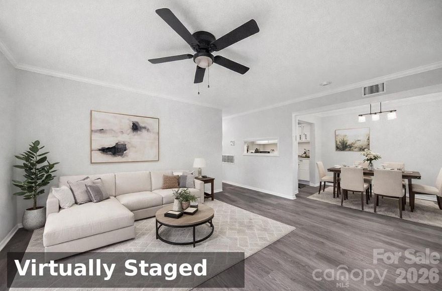 Welcome to this beautifully updated 2-bedroom, 2-bath condo in the heart of SouthPark—one of Charlotte’s most desirable locations! Featuring a sought-after split-bedroom floorplan, this layout is ideal for roommates, investors, or anyone seeking privacy and functionality.

The bright and open living space showcases durable LVP flooring throughout the main areas, while the white galley kitchen offers a clean, modern feel with subway tile backsplash and ample cabinetry. Both bedrooms are generously sized with well-appointed bathrooms.

Enjoy outdoor living on the spacious deck—perfect for entertaining or relaxing. With plenty of parking and unbeatable proximity to shopping, dining, and everything SouthPark has to offer, this is an incredible opportunity at an attractive price point.
This home has been virtually staged.