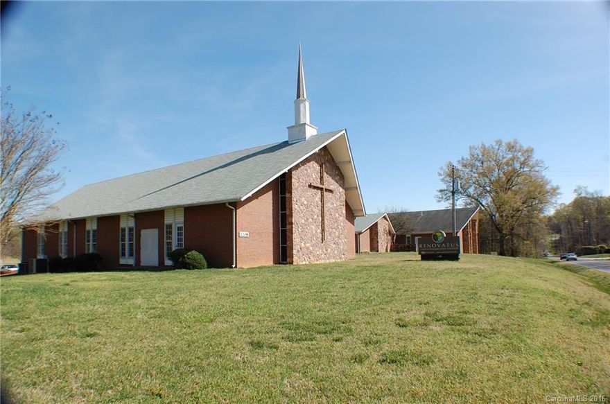A remarkably well planned and functional house of worship with an adjacent classroom/gymnasium. Numerous assembly, classroom and common areas with over an acre of heated and air conditioned area. A large softball field and play area adjoins the classroom/gymnasium.  23+- acres with over 2200 ft of road frontage on Little Rock and Paw Creek Roads.  The main sanctuary comfortably seats about 440. A large assembly hall with equipped kitchen provides abundant service overflow and fellowship area.