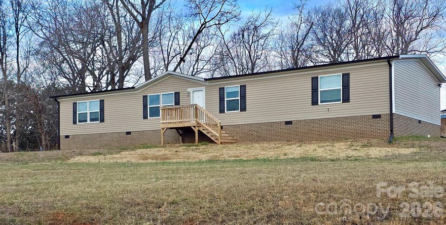 Spacious move in ready property equipped with stainless steel appliances, island kitchen, ample counter top and cabinet space.  Open floor plan with split bedrooms. Dining area that is roomy enough for a den and living room. Primary bath features large garden tub with shower, huge walk-in closet including clothes racks already installed.  There is also another full bath with tub/shower combo and linens shelving nook.  This property also has an additonal room that can be used as a bedroom, recreational room, office, etc...Laundry room has enough space for an upright freezer or extra storage. Close to Statesville and I-40, making it convenient to major thoroughfares. NO HOA's