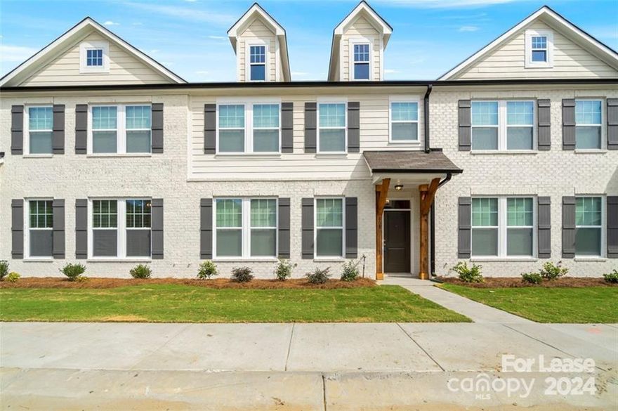 This two-year-old Luxury Townhome in Pineville directly across from Jack Hughes Park, Featuring 3 bedrooms & 2.5 baths with 2 car garages. The Luxurious Kitchen boasts an oversized Quartz Carrara Island & countertops, white subway tile backsplash, stainless steel appliances including a gas range & Refrigerator. The kitchen flows into the large living room space in this spacious open floor plan design. The upper level features the primary suite with custom tray ceiling with a luxury primary bath, tiled shower, dual vanity & large walk-in closet. Loft area great space to add your home office. The remaining 2 bedrooms are amply size & offer plenty of closet space. The laundry finishes the upper floor. Only minutes to Ballantyne, Carolina Place Mall & the light rail. The Main Street of Pineville offers friendly local merchants offering a unique blend of stores, furniture, brewpubs, restaurants, & quality personalized services. This is the Townhome you been looking for hurry it won’t last!