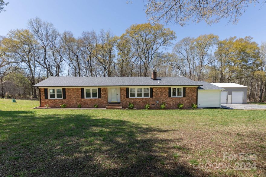 Welcome to your dream home! This beautifully updated brick ranch sits on a spacious 1.65-acre corner lot. With 3 bedrooms and 2 baths, this home offers ample space. The heart of the home is the inviting kitchen, featuring stainless steel appliances, a farmhouse sink, and a cozy dining area perfect for hosting gatherings. Relax and unwind in the great room by the charming brick fireplace, complete with gas logs for those chilly evenings. Enjoy the convenience of an oversized 1-car attached garage, as well as a separate oversized 2-car detached garage equipped with power and a wood stove, ideal for hobbies or storage. Outside, revel in the privacy of the fenced backyard. Don't miss out on the opportunity to make this your forever home!