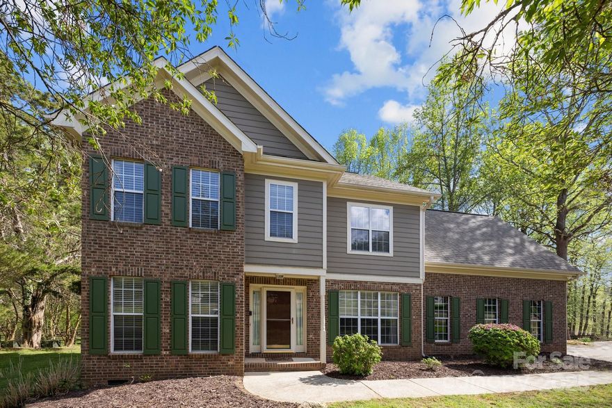 Welcome to your dream home in Oxford Glen! This charming 4-bedroom, 2.5-bath residence sits on nearly an acre in desirable Mint Hill. The light-filled main level features an open layout with durable LVP flooring throughout, including a dedicated office, formal dining room, spacious living room, sunroom & a kitchen with breakfast nook—perfect for morning coffee in the sunshine. A convenient laundry room & half bath round out the first floor.
Upstairs, you'll find all 4 bedrooms, including a generous primary suite complete with a walk-in closet & ensuite bath featuring a garden tub. A second full bath & an oversized 4th-bed/bonus room above the garage provide versatile living space for any need. Step outside to an expansive deck overlooking a private, wooded backyard—ideal for entertaining, relaxing, or letting pets roam free. With southern exposure, the sunroom & kitchen area are drenched in natural light year-round. This home offers space, comfort & incredible value—don’t miss out!