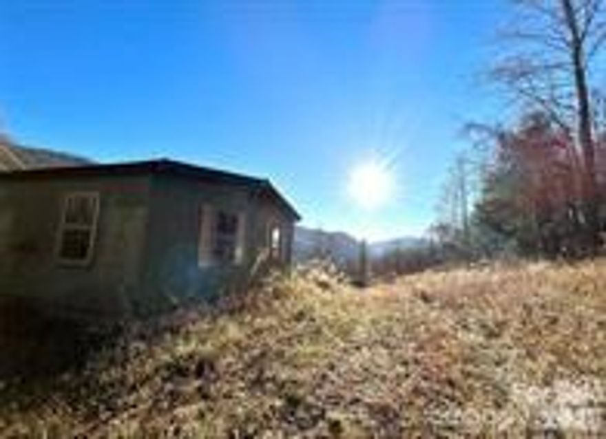 Part of an old farm. Located Off Hwy 209 , Betsy’s Gap road , Clyde ; Hard to find 28.11 acres with improvements ; has beautiful Mountain Views, partial fencing,( 4 acres of pasture w/ shed ) 2 springs , and is UNRESTRICTED.  Checkout the Long range views, private corner lot, older MF home stays ( personal property, Being sold AS IS ) needs repairs , OR build your dream home here! Has gravity flow Spring water,(Needs hooked back up)  lower part of the Land is rolling/ somewhat sloping, some hilly,  Mountain is steep but has old winding trails. Septic in place, electric in place, road to homesite in place, Also has additional approved septic perk certificate located below the present home site  ( lower area of land ) Lots of possibilities! Old MF home is personal property; Can be refurbished or town down and build here! At least two good Home sites. Disclosure: Listing agent is related to some of the sellers. 

Come own Your very own mountain today!