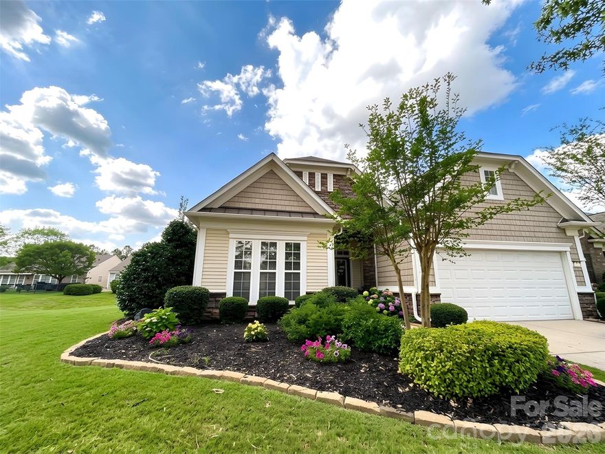 Welcome to Sun City Carolina Lakes, one of the most sought-after active adult communities in the Charlotte metro. Beautiful move in ready, 3 BR/3BA home centrally located on corner lot, in highly sought after, energetic yet tranquil amenity rich Sun City Carolina Lakes active adult lifestyle resort community.  Diverse amenities for all: 2 -beautiful clubhouses, public golf clubhouse, challenging golf course and driving range. Indoor/outdoor pools, pickle ball, tennis, bocce, fitness centers, walking trails, river kayaking, ball fields, crafts, woodworking, community gardens and approx. 140 social clubs, activities.  This spacious approx. 2700 sq-foot open-concept layout corner lot home with natural light, is neutral modern decorated, with many NEW modernized features and LOW maintenance benefits: Roof replaced 2021, new hot water heater, LVP low maintenance flooring, new carpet. Modern eat-in kitchen with new quartz countertops, wide deep sink/faucet, garbage disposal, new stainless-steel appliances, a large center island, lots of cabinets and storage throughout the home and above the 2-car garage. Plenty of room for the car and a golf cart with additional spaces in driveway for guests. HOA only $321 per month includes amenities, lawn mowing, and annual mulch. Spacious main-level living (approx. 1954 sq ft). Cozy living and dining area, gas fireplace, Lg. luxurious primary suite, with tray ceiling, walk-in closet, ensuite bath, quartz top dual-vanity, soaking tub, separate shower w/grab bars and seat, lg. walk in closet. 2nd bedroom on the first floor with full bath AND a private office/study, convenient laundry room. BONUS: Discover a versatile second living area upstairs (approx. 727 sq ft), ideal for entertaining, visiting family, an office, hobby studio, gym or even a future caregiver’s suite, with a large living room, bedroom, full bath, and extra storage.   Home is on beautiful corner lot for fresh outdoor living. Semiprivate screened sunroom with custom shades, backed by mature shrubbery and a separate dining patio for outdoor grilling. Area is booming, close to all medical, shopping, restaurants, recreation, entertainment, airports approx. 40 min., and all Charlotte has to offer!  Come and See, Schedule Appointment. Move right in and start living your best life today! Seller is a SC licensed real estate agent.