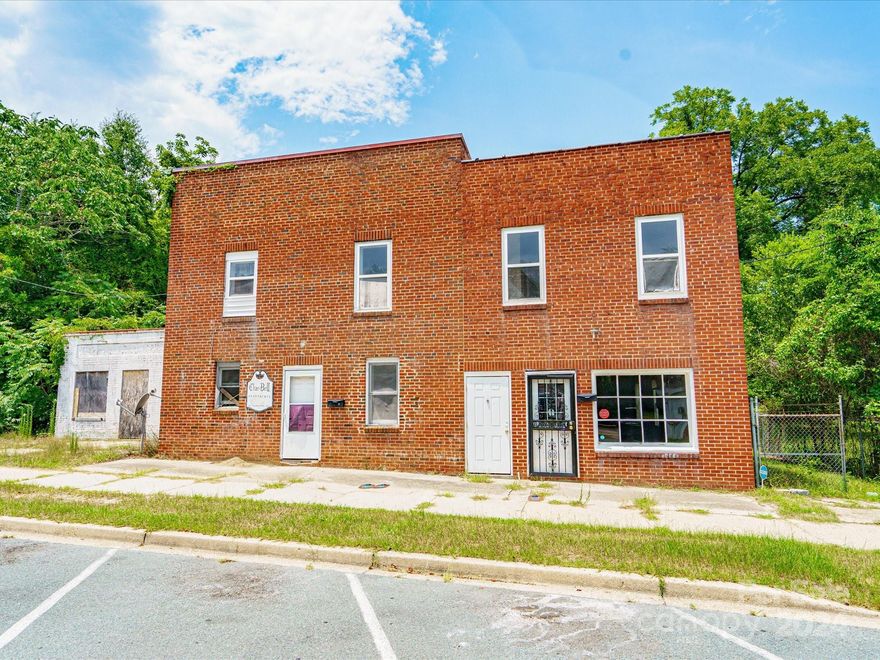 Incredible investment opportunity!!! Once known as"Char-bell Apartments," this building also housed Sonnie’s Grill and Lounge and Superior Dry Cleaners. Though the façade has changed, the charm and stories remain. The property is one of many along Kershaw and Second Streets that served a thriving business district during segregation. It not only serves as a direct physical link to Cheraw’s storied history, it provides an incredible investment opportunity. Currently, the building is set up for one commercial space downstairs and three 3 BR/1BAapartments. The downstairs apartment is 970 sq. ft; the upstairs apartments are approx. 970 sq. ft. and1100 sq. ft.; and the "shop" with half bath is just under900 sq. ft. This property is zoned "neighborhood commercial," and has potential to qualify for tax incentives. Please note, the small white building is not attached or part of this property. Pre-qualifiedbuyers only.