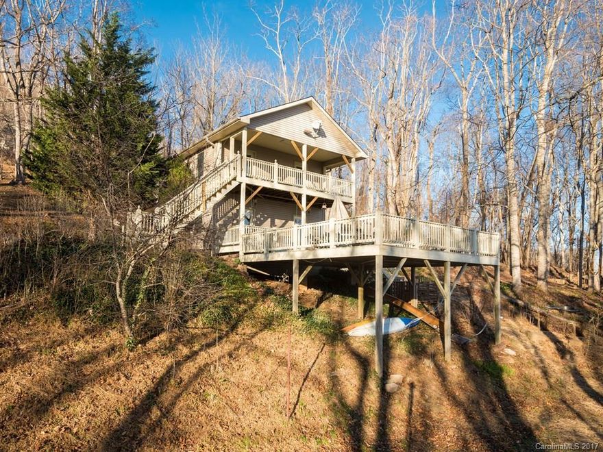 Nestled on 2.88 ac this WNC mountain retreat offers an excellent opportunity for a private residence or VRBO/Airbnb. Featuring HW floorS, master on main, attached storage bldg & carport and expansive deck with stunning views of Little Pisgah Mountain. With addition of upstairs kitchenette (plumbing in place), this mountain cottage could offer 2 rental opportunities each with private entrances. Plenty of room to expand or add addtl cottage. >20 to DT. COME RELAX in this peaceful mountain setting!