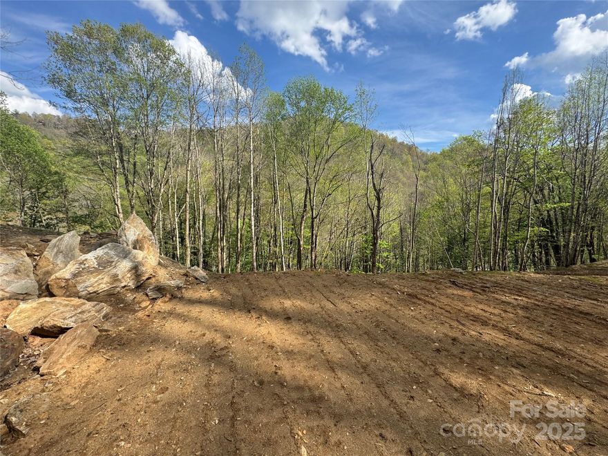 Beautiful, wooded mountain setting for these two lots in private location. Walk to newly renovated Hatley Pointe Resort and Restaurant, Village Club Amenities that includes pickleball, pool, tennis courts and many community events. Great place to build your mountain dream home, just minutes from security gate entrance. Improvements include clearing, house seat and driveway, current survey and easy road to property. Over $30,000 in improvements will save you time and money. Very special opportunity, don't miss this special location in a gated community with many activities offered.