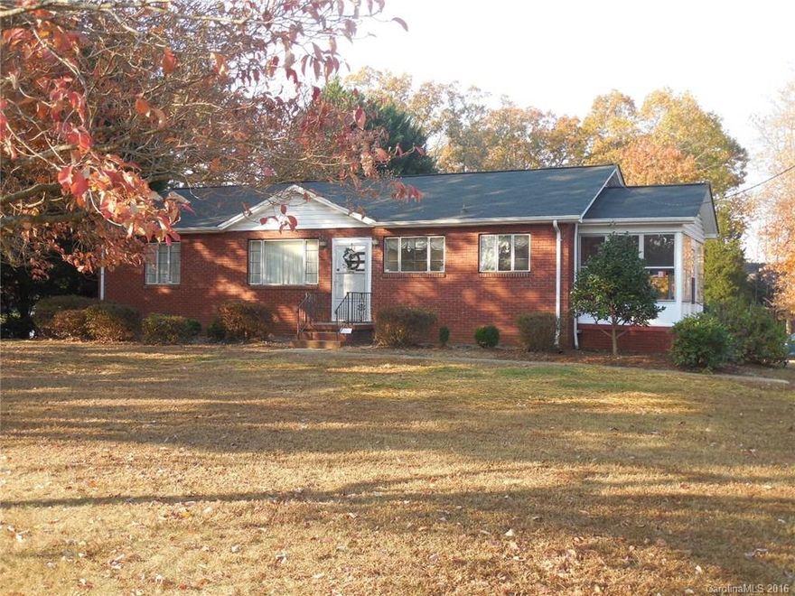 This 3 Bedroom, 1 Bath Brick home sits on .84 acre and has a full basement. There is a 8x15 sun room, a detached garage, a single garage in the basement, a dbl carport on back and a metal building. The inside is freshly painted and part of the exterior. Hardwood floors in the living room and 2 bedrooms (owner says under carpet in 3rd bedroom as well). The basement has another sink & stove that previous owners used for canning. Level lot. Great home. New roof 2010.