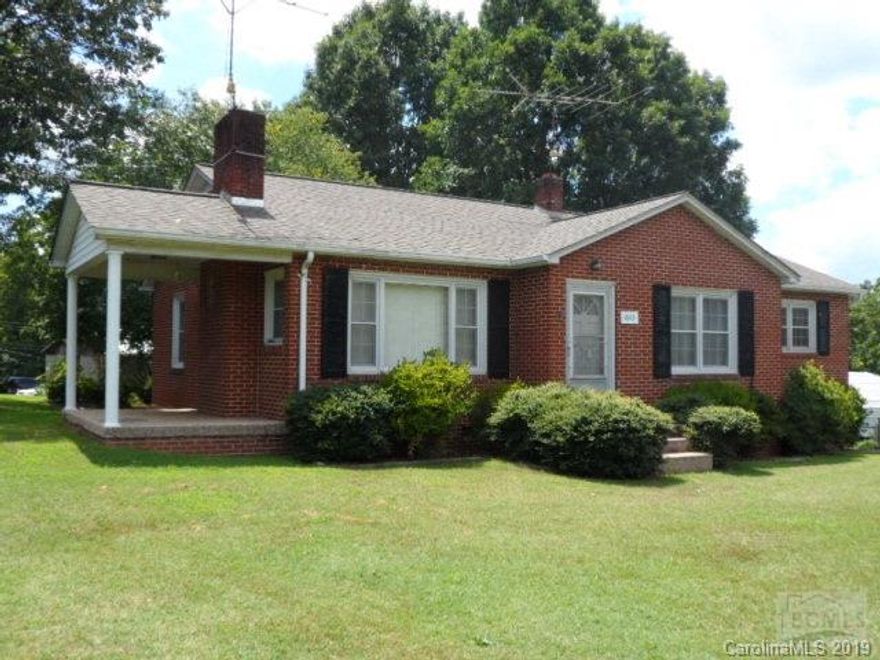 Well maintained two bedroom one bath brick veneer ranch style home on corner lot. Partial basement. Detached two car block open garage with attached workshop. Double metal carport off basement. Large kitchen with separate dining room. Convenient to both Drexel and Valdese.