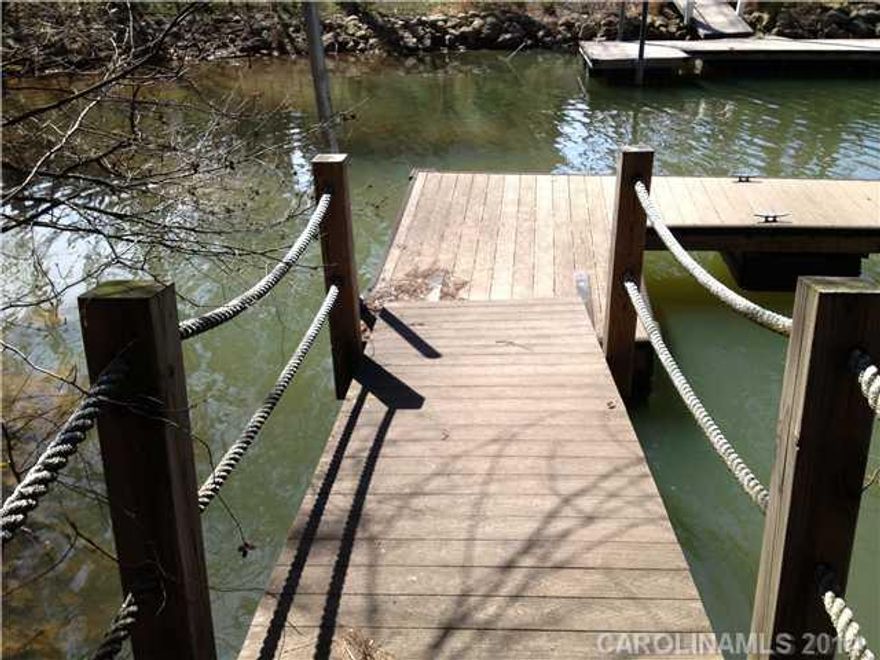 WATERFRONT LOT with dock in place.  Denver location with great schools and low taxes.  Bring your builder.  No time limit to build.  Excellent opportunity for waterfront living.  Eastwind Cove offers Community Pool and Cabana, boat storage waterfront lots available from the low 100k's.