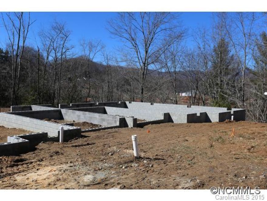 Single-level Living at its Best! Beautiful townhome under construction, located between Downtown Waynesville & Lake Junaluska. Features will include 2 master suites, open floor plan, granite counter tops, stainless steel appliances, breakfast bar, single-car garage, large rear deck, and much more! EM to Buyer's Attorney.