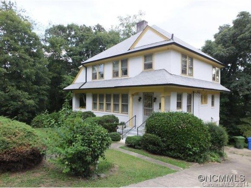 First time on the market in 84 years! Currently under contract but accepting backups. Classic English Arts & Crafts Bungalow overlooking the City of Asheville with sunny, southern exposure on 3 lots.