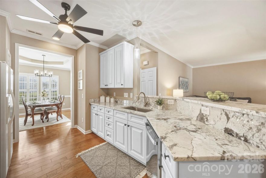 Welcome home to this charming and updated two-story townhome nestled in a highly sought after waterfront community on beautiful Lake Wylie! Step inside to find hardwood floors throughout the main level, updates galore including plantation shutters, updated light fixtures, and a layout designed for both everyday living and entertaining. Enjoy an updated kitchen featuring beautiful granite countertops, multiple dining spaces, a cozy gas log fireplace in the living room, and an additional flex space which would make a great sitting area or office. Enjoy warm or cool nights on the screened porch overlooking the fenced backyard- perfect for morning coffee or unwinding in the evening. Upstairs, the spacious primary suite offers a peaceful retreat with elegant trey ceilings, his and hers walk-in closets, and a private ensuite bath complete with a separate shower and garden tub- perfect for relaxing at the end of the day. Two spacious additional bedrooms, a full bath, laundry room and all new carpet and tile complete the upstairs. Enjoy the lifestyle this Lake Wylie waterfront community offers, including a community pool overlooking the lake, scenic surroundings, community beach area, and optional boat storage for those who love being on the water. The HOA covers exterior maintenance, yard care, streetlights, road maintenance, garbage and recycling service, and pool access, making this the perfect opportunity for easy, low-maintenance living in a beautiful lakefront setting! Come see it today! NEW GAS WATER HEATER MAY 2026!!
