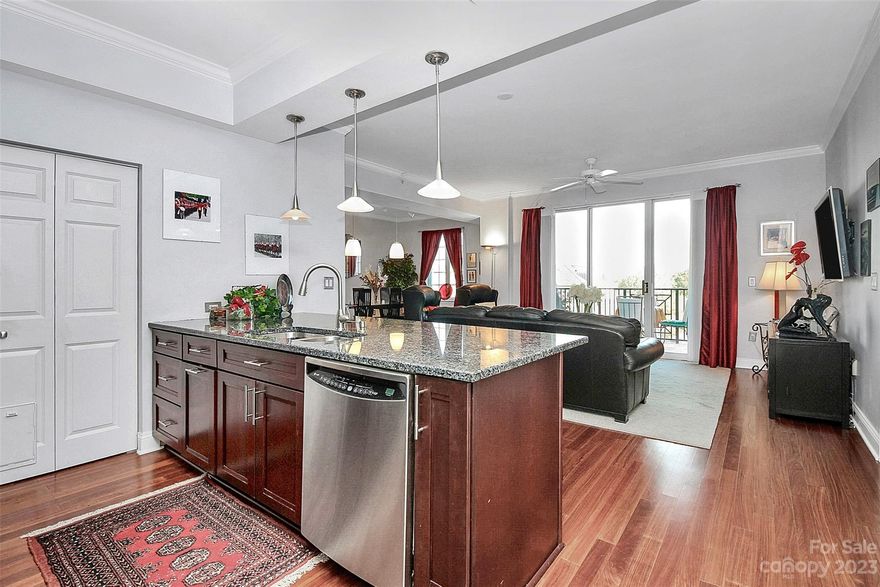 WOW -This unit is ONE OF A KIND!! Unlike ANY you’ve ever seen @ 5th & Poplar!!  Two 1 bed units merged together to create this EXTRA LARGE 2 bed /2 bath custom split bedroom floor plan unit w/ TWO deeded parking spaces (most only have 1 space)! HUGE living space - Plenty of room for living & dining, HVAC replaced in 2018. Custom Kraftmaid cabinets, ss appliances, lowered granite countertops, wood floors, custom remote blinds, "California closets", MARBLE in both baths (Master bath is amazing w/ shower & separate tub!), butler's pantry, wine chiller & an incredible view of the courtyard from the 6th floor!  Amenities include 24 hour concierge, resort style pool, 1 full acre courtyard, workout facility, fireside terrace, cyber cafe', clubhouse, putting green, pet park & gated, assigned parking. AND Harris Teeter is located IN YOUR BUILDING - just an elevator ride away! Close to sporting events, countless dining options, nightlife, & more. It WILL NOT LAST - don't miss this opportunity!
