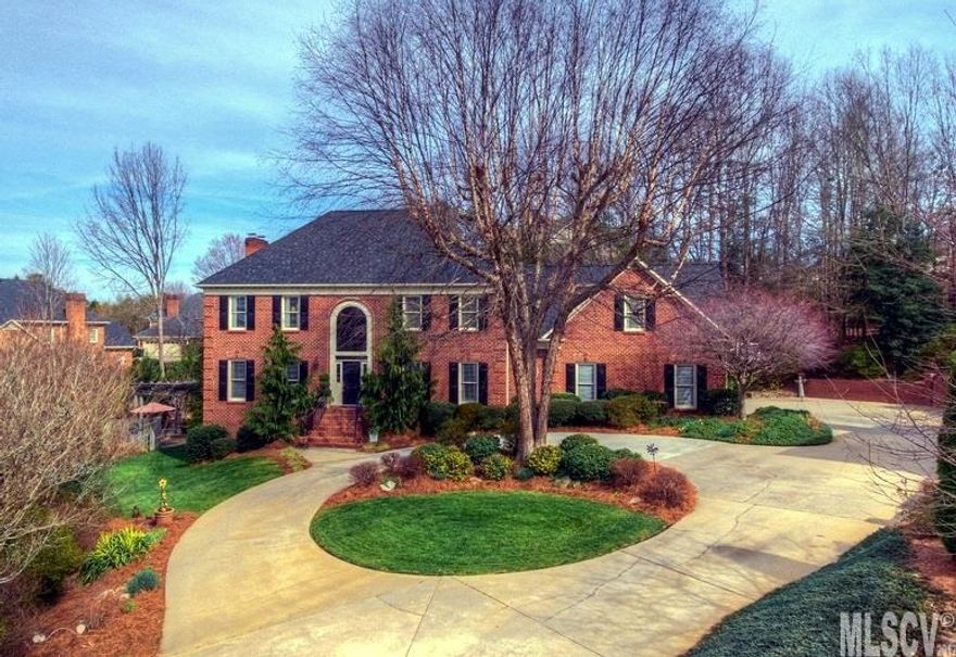 Beautiful all brick 2-story with basement on private park-like cul-de-sac lot. Formal LR & DR & dramatic 2-story entry foyer. Stunning remodeled kitchen offers a center island w/seating, upscale stainless appliances, granite c'tops, pantry & coffee bar closet. Kitchen is open to the den w/gas log FP & built-ins and adjoins the bright sunroom overlooking the stunning backyard w/waterfall, pond, pergola, gorgeous plants & flowers and 2-level deck. 2 stairways lead to the 2nd level. MBR suite w/private MBA, huge WIC, separate vanities, garden tub & sep shower. 3 additional BRs, one with private en suite BA & WIC. Basement offers large den/rec room, full BA, garage, workshop & plenty of storage space. Rear patio w/hot tub. Circle driveway in front plus additional parking pad in rear. Security system & irrigation system.