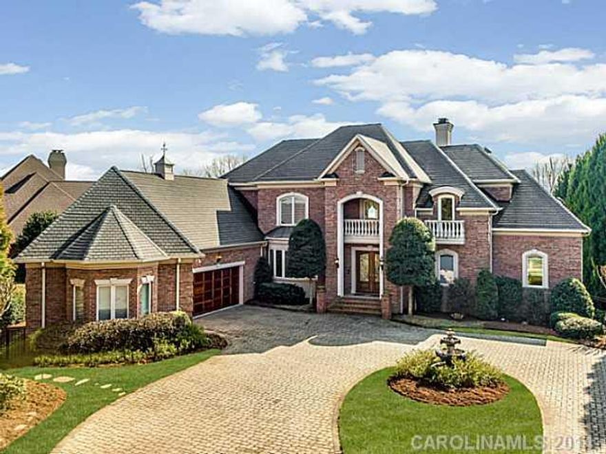 Dazzling unobstructed views of Lake Norman greet your guests at the front door. Dock the boat and entertain them poolside from the fully equipped outdoor kitchen -watch the game perched at the bar, or in the lake level theatre.  Huge kit w/commercial stove, opens to oversized GR w/stone fpl. Elevator, pet rm w/shower, lake level bar, billiard, exercise & steam. Walk or bike to The Peninsula Club.