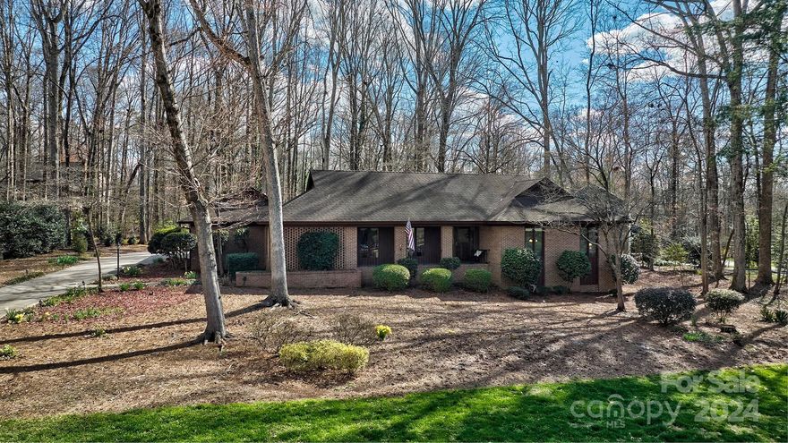 Great all BRICK RANCH in River Hills on Lake Wylie!Home is situated on 1 of the most desirable roads in the neighborhood.Flat lot & room for a pool!The home offers formal living room & dining room that open to the kitchen w/ center island & seating/ eat in area that opens to the paver patio.This one has double ovens and gas cooktop.There is a large great room with a stacked stone fireplace that also opens to the patio.Nice size primary bedroom w/ large walk in and updated bathroom,2 more bedrooms,a full bath ,1/2 bath AND big storage room right off the kitchen and can enter from carport.There is a finished walk up attic that could easily be made to heated and cooled space w/ a split unit for office or bonus room. Neighborhood offers miles of walking trails,waterfront park w/ sandy beach & picnic pavilion,marina,country club w 18 hole course &,pools,playgrounds,gardens & dog park.Highly rated Clover Schools too!Home is empty so bring your ideas to update & price reduction to do it!