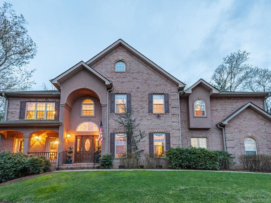 Exquisite Brick home w/so much attention to detail. ABSOLUTELY must see to appreciate. Upscale everything from the crown moldings, cathedral ceilings to the beautiful h/w floors.  Gourmet kitchen w/curved island, high end SS appliances, loads of closet storage & custom window treatments. Mstr suite beyond your dreams w/office, massive walk-in closets & luxurious bath. Private wooded setting w/waterfall, ironwood decking & wonderful landscaping.  This home is like new and priced to sell.
