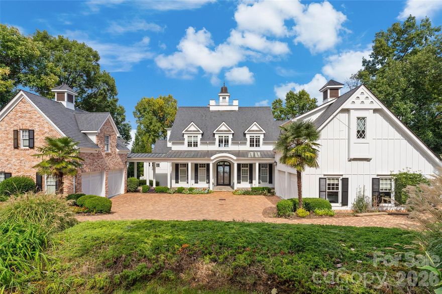 LUXURY PROPERTY AUCTION: 17–30 June.
Accepting starting bids through 16 June.
Starting bids expected between $4.5M–$6M.

Lake Norman has no shortage of waterfront homes, but few earn the word landmark. This Nantucket-inspired estate by Patrick Joseph Distinctive Homes is one of them. Set on a private cove in the prestigious Peninsula area, the property delivers panoramic lake views from nearly every room across four thoughtfully designed levels. A drive-through brick motor court and custom pivot entry door set the tone before you step inside. From there, the home unfolds with the kind of detail that accumulates over time and reveals itself slowly: Sub-Zero, Wolf, and Miele appliances in the dream kitchen, a spa-level primary suite on the main floor, a 10-seat home theater, a wine cellar, and a full entertainment level with bar and fireplace that opens directly to the saltwater pool. Outside, a covered deep-water dock with boat lift brings the lake to your doorstep. Multiple covered porches and terraces complete a property where the water is never far from view. The sale also presents the opportunity to acquire a full golf membership at The Peninsula Club, bypassing the waiting list entirely.