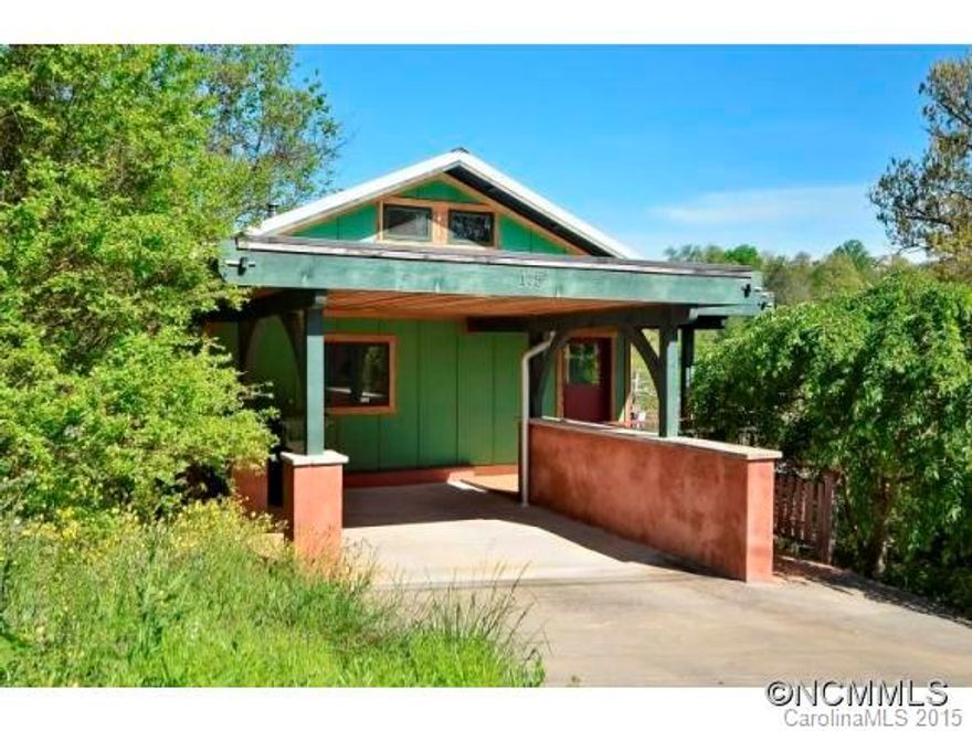 Located between Downtown, hospitals and the River Arts District. This 3/2 NC Healthy Built adorable home has 14ft barrel vaulted ceiling with an open kitchen, dining and living room. Carport was designed for a roof garden. 8x24 deck off living room, small loft over kitchen, solar hot water and radiant floor, metal roof, Japanese soaking tub in full bath, stained concrete floors, mosaic tiled shower. All utilities are less than $80/month.