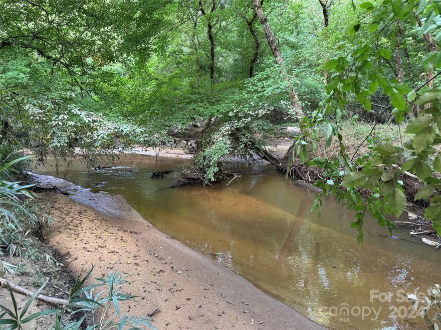 Truly a spectacular property and a once in a lifetime chance at this opportunity. Rare in size and location, this 182.54 acre gem is conveniently located 35 minutes South of Charlotte! With close access from I-77 and HWY 21. There is a massive amount of wildlife, acres of hardwood bottoms, 2200' of Tinkers Creek flowing at the back, and loblolly pine production! This can be used for Hunting/Recreation, income potential, forestry/agricultural, deferred property taxes, or a personal residence / family compound! Electrical & Fiber Optic Internet available!  Quality soil for conventional septic systems. 1100' of road frontage; many options for homesites. If you are looking for a tranquil homestead tucked back in the woods, this is the piece of land for you! Pursue building your dream home and embrace the country lifestyle. Loaded with animals for recreation and hunting purposes. Survey and soil map available.** No Manufactured homes**