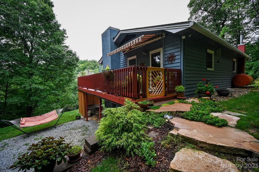Privacy! Privacy! Privacy! Park like setting yet located in Boone close to everything the High Country has to offer. Enjoy the wildlife and bird sanctuary on over one and half acres. Very well cared for inside and out. Come see the many details this home has to offer. Rock wall and steps in back yard are simply stunning, adds to the character and charm! Flowers and plants galore. Notice the craftsmanship on the stone fireplaces. Recently upgraded kitchen, appliances and bathrooms. New roof in 2022. Downstairs is currently used as an Airbnb with $25-$30,000 annual income potential. Barn door to laundry room area. Perfect for fulltime living or your mountain retreat. Come see this gem of a place today!