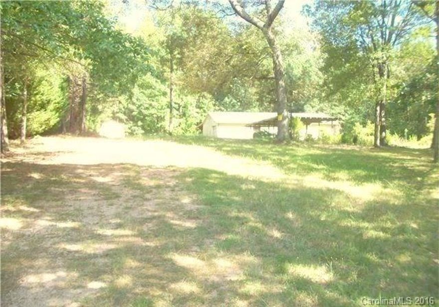Build your dream home on this 1.62 acre lot. Flag lot sets back off of Trinity Church Road. Driveway is on Mountain Vine Avenue. Approved to build a 4 Bedroom home. Currently has a 2 bed septic system and is approved for 4 bed. Confirm septic with Mark Thompson at Cabarrus Health Alliance (704) 920-1207. City water available. Large 1800 sq. ft. storage building with attached 1440 sq. ft. covered storage and separate 120 sq. ft. storage building.