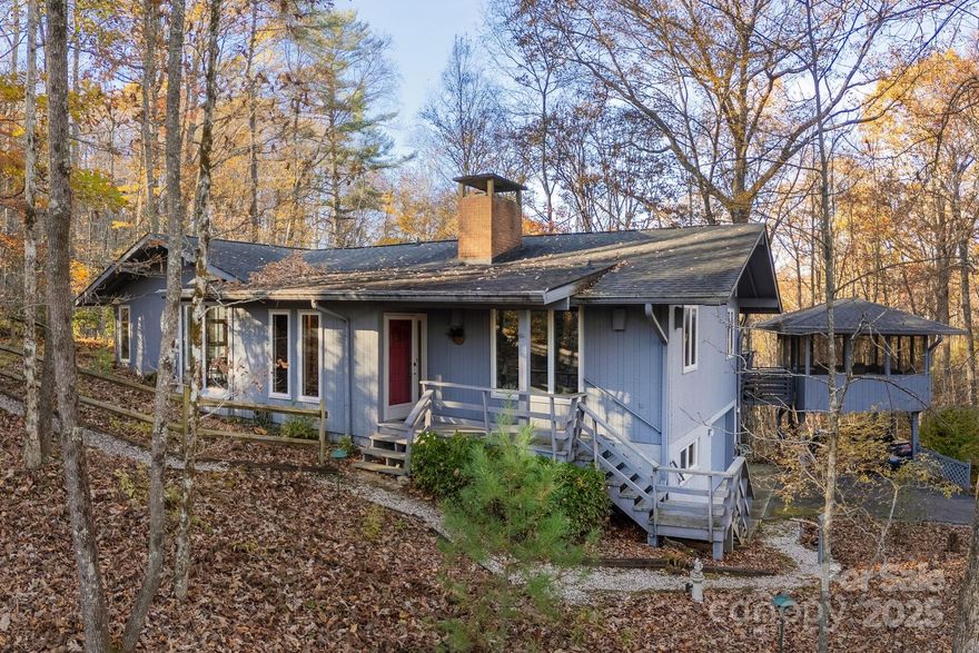 First-time offering, nestled in the heart of the coveted Sherwood Forest, lovingly named “Fern Hill” by the family who built it. From the moment you arrive, you’ll understand why, every window frames a postcard-worthy vista of swaying ferns and mature hardwoods, creating the magical sensation of living in a private treehouse sanctuary.  Spanning just over 3,000 square feet, the open-flow design seamlessly merges modern luxury with timeless warmth. The gourmet kitchen flows into sunlit living spaces adorned with premium finishes and electric fireplace insert. Currently configured with two bedrooms plus a dedicated office and den, the layout lends itself beautifully to reimagining as a sprawling primary wing. This home has slept eight comfortably when the extended family visited.  Step outside to the rear deck and into the screened porch, where al fresco dining feels suspended among the treetops.  With an exterior entrance to the basement level, this space would make an amazing in-law suite.