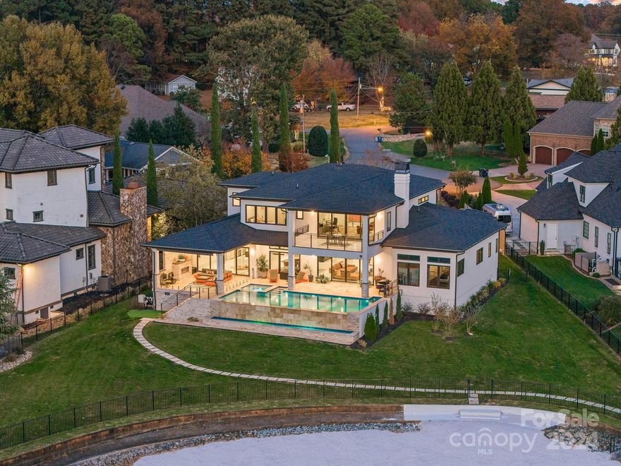 Location, Location, Location.

Nestled on a peaceful cul-de-sac overlooking the most breathtaking views of Lake Norman, this exquisite smart home/lakeside property epitomizes luxury living at its finest with a spectacular new feature pier and boat dock. 

Step onto sleek white Italian porcelain floors, marvel at the elegance of hardwood trey ceilings and floor-to-ceiling windows that flood the home with natural light.

Entertain with ease in the state-of-the-art kitchen featuring Cambria Quartz countertops and backsplash, Subzero refrigerator/freezer, Kitchen Aid gas stove range & double oven, Wolf built-in coffee system, and under the counter microwave oven.

Retreat to the opulent master suite featuring walk in closets, a stand-alone soaking tub with ceramic tile walls, offering the ultimate in relaxation and indulgence

Lounge in luxury by the  heated saltwater infinity pool , all while enjoying breathtaking views of the lake and stunning West-facing sunset vistas.