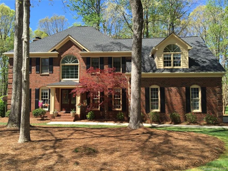 Beautifully maintained 2-Story all brick home in a "highly desirable neighborhood". NO HOA DUES! Situated on 1.15 wooded acres. Recently updated kitchen with granite countertops, dbl oven, gas stove and beverage center. All new Electrolux appliances. New hardwood floors on lower level. HVAC 2007 with pure air filter system, Roof 2010, Gutter Guards 2012, Crawl Space encapsulated with dehumidifier 2014. Garage is spacious with built in cabinets, plenty of storage and professional epoxy floor.