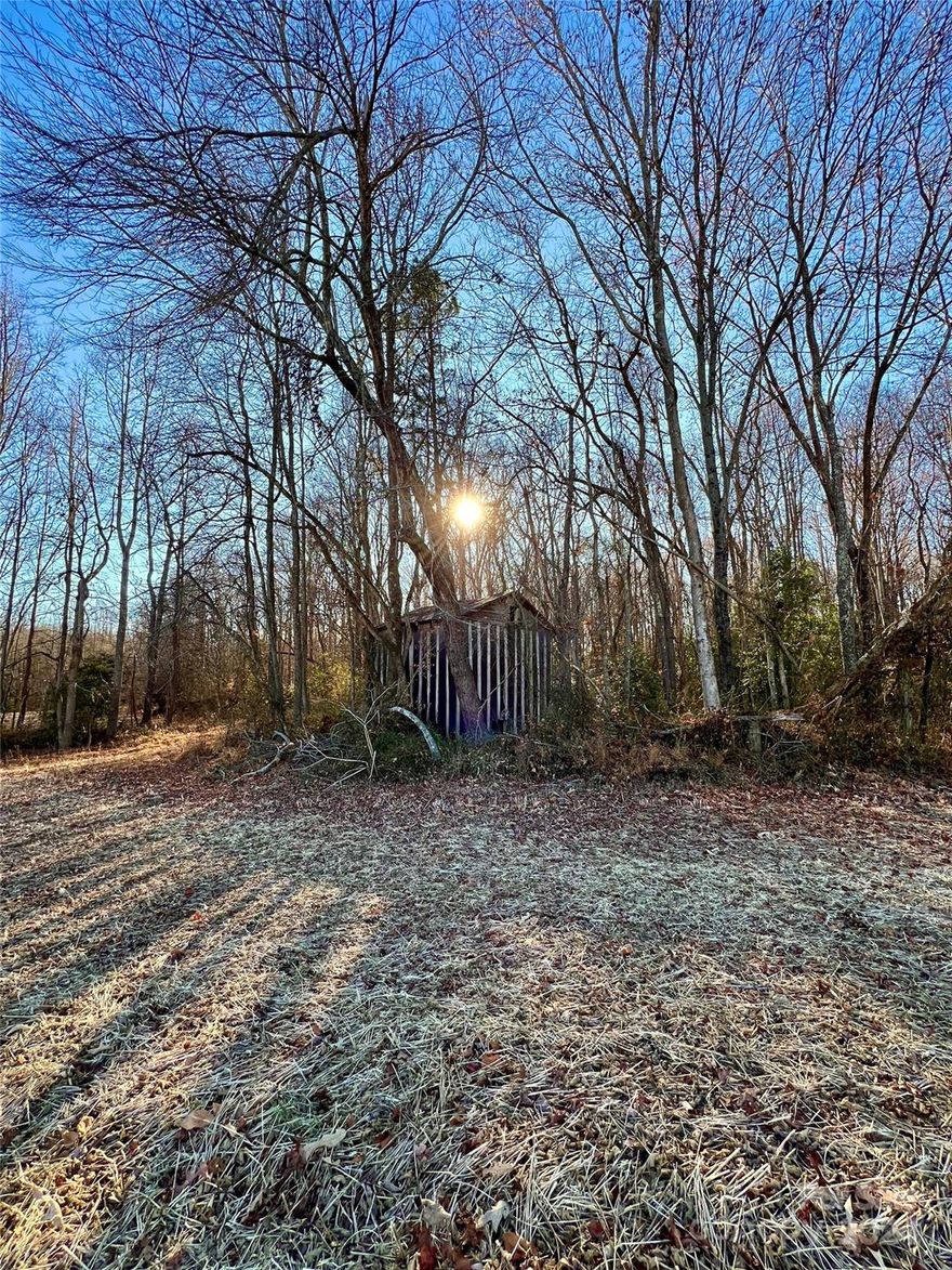 Beautiful property in North Iredell! This dream property is over 27 acres. Eleven acres of cleared property currently used as crop land is adjacent to the road. The remainder of the property is perfect for exploring with mature trees and a gentle stream along the rear property line. Iredell Water hookup is available on Semper Fidelis.