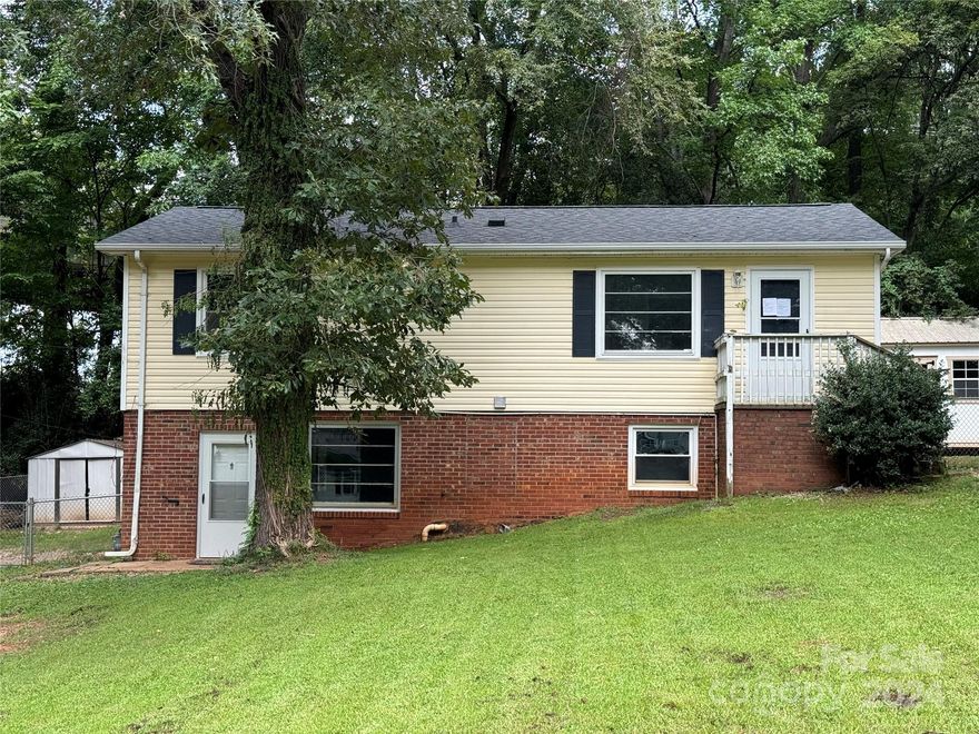 Brick/Vinyl Duplex, great investment opportunity, move in ready,1st Floor and Basement Units Feature: 3 Bedrooms, 1 Bath, Living Room, kitchen/Breakfast Area, Washer/Dryer hookups.  Fenced in backyard with privacy fence separating the units.  Metal storage building remains, Large wooden storage building does not convey:Tenant owned