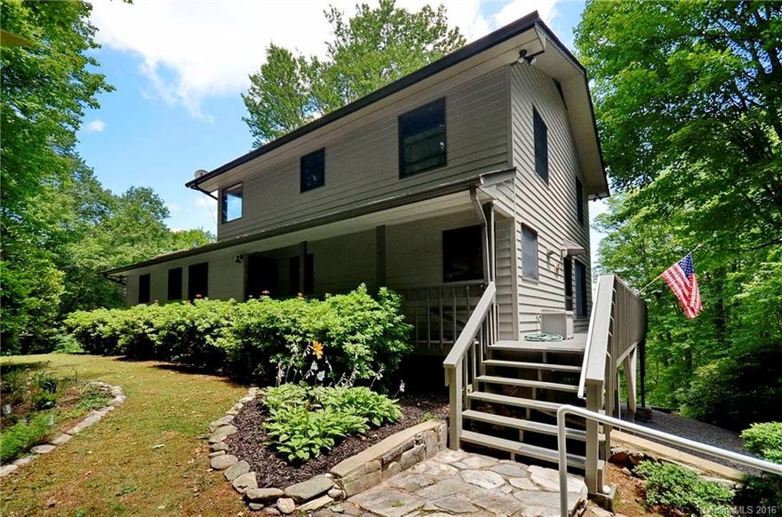 2Bdrm/2.5Ba plus a 3rd bonus rm/bdrm  This Private Mtn home offers sensational Multi-Ridge Mtn Views! Large Kitchen is adjacent to a 20' vaulted Great Rm which includes native stone gas FP & open flrplan. Wrap-around deck. One family have been the sole occupants to savor this end of the road masterpiece, boasting original wood flrs, Master on Main, tongue & groove ceiling in Great Rm & Master. Lge Workshop/Studio off garage. Minutes to downtown Waynesville!  Exterior & Deck recently stained.