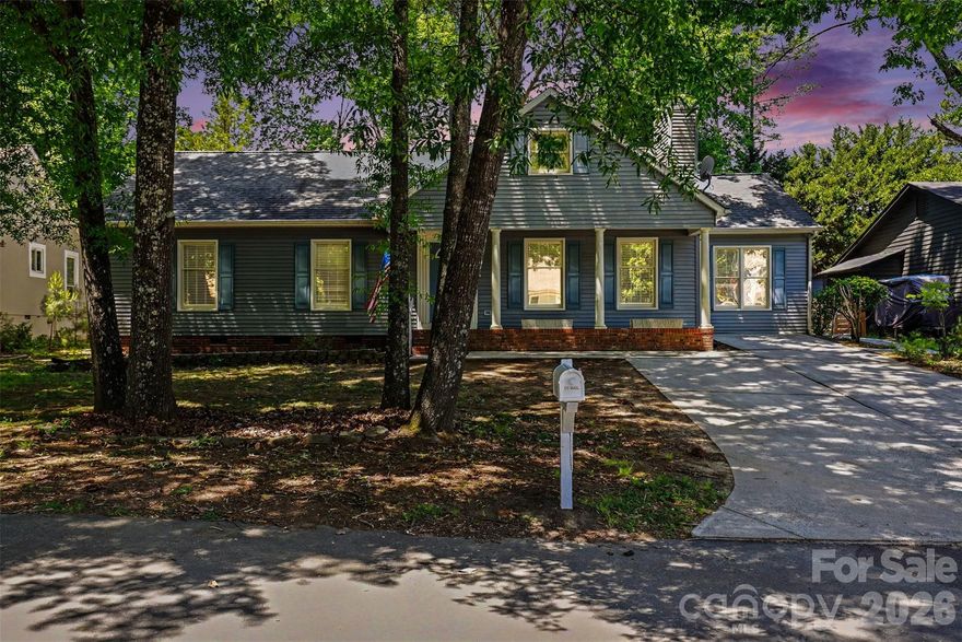This beautifully updated ranch style home in sought after Tega Cay offers the ease of one-level living, paired with bright and open spaces. Hard to find 4 Bedroom Home that's Freshly Painted with a Renovated Kitchen! Tucked away on a quiet street, this home welcomes you with charming curb appeal and a covered front porch perfect for relaxing outdoors.

Inside, you’ll find over 2,060 square feet of thoughtfully designed living space featuring soaring ceilings, abundant natural light, and updated finishes throughout. The spacious living room is anchored by a stunning floor-to-ceiling stone fireplace and flows seamlessly into the dining area and kitchen, creating an ideal setup for both everyday living and entertaining.

The kitchen has been renovated with white cabinetry, stainless steel appliances, recessed lighting, generous counter space, and a large island with bar seating. A sunny breakfast area surrounded by windows creates the perfect spot for morning coffee or casual dining. Large sunroom provides flexible additional living space for a sitting room, office, playroom, or hobby area!

The oversized primary suite offers a spacious retreat with vaulted ceilings, dual closets, and an en-suite bath complete with a soaking tub. Three additional bedrooms provide flexibility for guests and work-from-home needs, all conveniently located on the main level.

Outside, the backyard offers privacy and room to enjoy the outdoors, while the detached storage building adds valuable extra storage space. Moisture barrier in the crawlspace. Fully fenced in back yard!

Conveniently located near shopping, dining, golf, parks, lake activities, and highly regarded schools, this move-in ready home combines location, space, and style in one of the area’s most established communities.