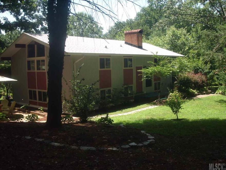 A 1954 Mid Century Modern home designed by Carl Koch Architect - original hand drawn plans on file. Spacious home on .64 acres in downtown Morganton with 2bedrooms and 2 baths. Home has original doors, bathroom fixtures and some lighting.  Kitchen has eating space and a bar. Great entertaining space with lots of room and 2 fireplaces. Walls of windows. Home has a 2011 solid state electric boiler as primary heat source and 2 new portable A/C units - which stay with home. New roof on house only in 2014. Carport  (21.5 by 17.5) is enclosed to become workshop with wood burning unit for heat and window A/C unit which also stay with home.