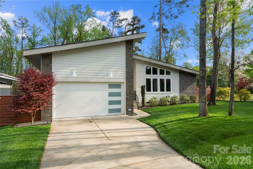Charlotte’s Shannon Park welcomes you to this stunning 2,252 sq ft mid-century modern home where style meets comfort. Built in 2020, this thoughtfully designed residence is one of only five exclusive homes in the Usonia on Lakedell community. 
From the moment you arrive, you’ll notice the striking curb appeal with clean horizontal siding, warm stone accents, and a welcoming front porch. Inside, the open-concept layout features soaring ceilings, expansive windows, and abundant natural light throughout the main living spaces. 
The modern kitchen is built for both everyday living and entertaining, showcasing custom cabinetry, quartz countertops, tile backsplash, gas range, and a large island that flows seamlessly into the spacious living and dining areas. 
The primary suite provides a spacious retreat with a private ensuite, while two additional bedrooms offer flexibility for guests, family, or a home office. 
A spacious two-car garage adds convenience and extra storage.
Set on nearly half an acre, the property offers a large, fenced backyard with beautiful landscaping, exterior lighting, a rear deck, and patio—plus a smart irrigation system to keep the lawn lush year-round.
Ideally located just 2.5 miles east of Plaza Midwood off The Plaza, this home delivers modern design, functional living, and a prime Charlotte location all in one.