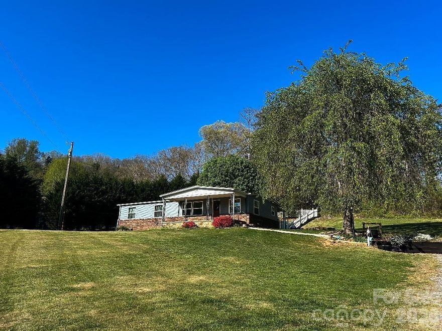 Enjoy the perfect blend of convenience and privacy with this beautifully updated home. Located just minutes from the interstate yet tucked far enough away to offer peaceful seclusion, you can relax on the large covered front porch and take in the quiet surroundings.
The thoughtful layout of the land makes the property feel even larger than it is, and the home itself has been completely remodeled inside and out. Move in with confidence knowing every major update has already been done. Improvements include new exterior vinyl siding, a fully refreshed interior with new paint, new laminate wood flooring, a new heat pump, new double-pane insulated windows, and updated appliances.
A cozy gas-log fireplace provides an excellent secondary heat source, adding both comfort and charm. The back door features a built-in doggie door leading to a spacious back porch and a fenced-in backyard—perfect for pets or outdoor enjoyment.
Additional features include a detached garage/workshop, offering great storage or hobby space, as well as a well-maintained well house with additional storage above.
This property is truly move-in ready and offers the peace, privacy, and updates buyers are looking for.