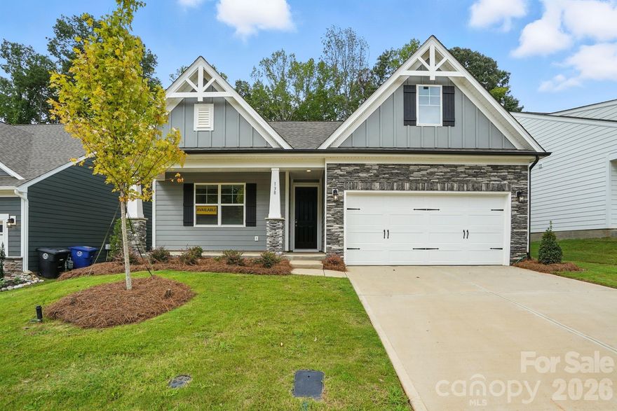 This home is READY NOW and has window blinds INCLUDED and already installed! This 1.5-story Stanley plan offers 4 bedrooms, 3 full baths, and more than 2,100 square feet of living space. The foyer with Craftsman-style wainscoting leads to the open family room with gas fireplace & stone surround, breakfast area, and designer kitchen. The kitchen features Stone Gray cabinetry, granite counters, tile backsplash, a stainless farmhouse sink, a range hood, and stainless appliances, including a gas cooktop. The primary bedroom on the main has a tray ceiling, and the primary bath includes a tiled, luxury shower with a bench seat & semi-frameless door, and two separate vanities. The main floor also includes two additional bedrooms, a second full bath, laundry room and mud room with drop zone. The upper floor has a loft, bedroom with two closets, and a full bath with a tiled tub/shower combo. Beautiful Enhanced Vinyl Plank (EVP) flooring runs throughout all rooms except for the bathrooms, which have tile floors. Community features nearby nature trails and includes lawn maintenance. Visit today and make this home yours!