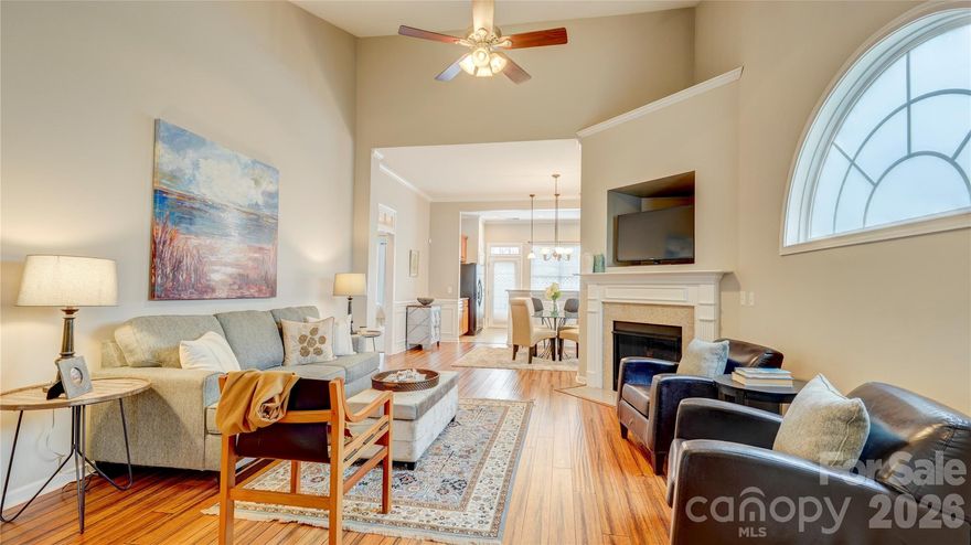 Convenient, one-level living in this end unit in Waters Edge. Inside, a foyer opens to a welcoming living room with a gas-log fireplace. It flows into the dining area and spacious kitchen, which offers a breakfast bar, solid-surface countertops, and access to the fenced back courtyard with garden beds. The primary bedroom features a tray ceiling and an ensuite bath with a soaking tub, separate shower, dual vanities, private water closet, and large walk-in closet. A second bedroom sits at the front of the home, adjacent to the hall bath. There’s also a full laundry room and a versatile flex/study space with built-in shelving and desk. Enjoy new carpet in the bedrooms and laminate wood flooring throughout the main living areas. The home also includes a level-entry one-car garage, driveway parking, and nearby guest parking. Community amenities include a pool, and the location can’t be beat. $5000 seller credit with acceptable offer by 2/28. Welcome home!