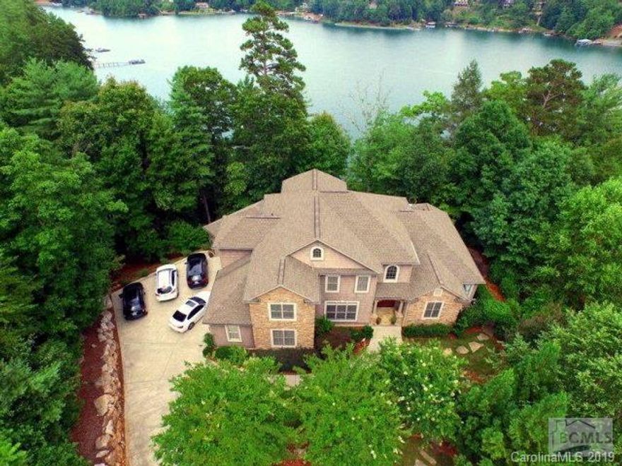 Enjoy Lake James Living at its best in this  Spacious, Transitional, Waterfront Home located in Southpointe... one of the most desirable Communities at Lake James.  You will be amazed at all of the upscale details and excellent workmanship in the construction of this home. Main level living area features floor to ceiling stone fireplace, hand scraped maple floors, soaring ceilings, and plenty of large windows for views of the lake.  Gourmet Kitchen with Granite Countertops, Stainless Appliances, Stove with pot filler, Double Ovens, Custom Maple Cabinetry, Center Island with Vegetable Sink.  One Master Suite is  on the Main level, with trey Ceilings and Large Master Bath.  Upper Level has Second Master Suite and Two Additional Bedrooms. Screened in Porch and Deck area .  Lower level of home has additional 2341 square ft  not included in total square footage, with media room and game room, and two additional bedrooms ready to  be finished. Home is situated on .60 acres, with 251' of lake