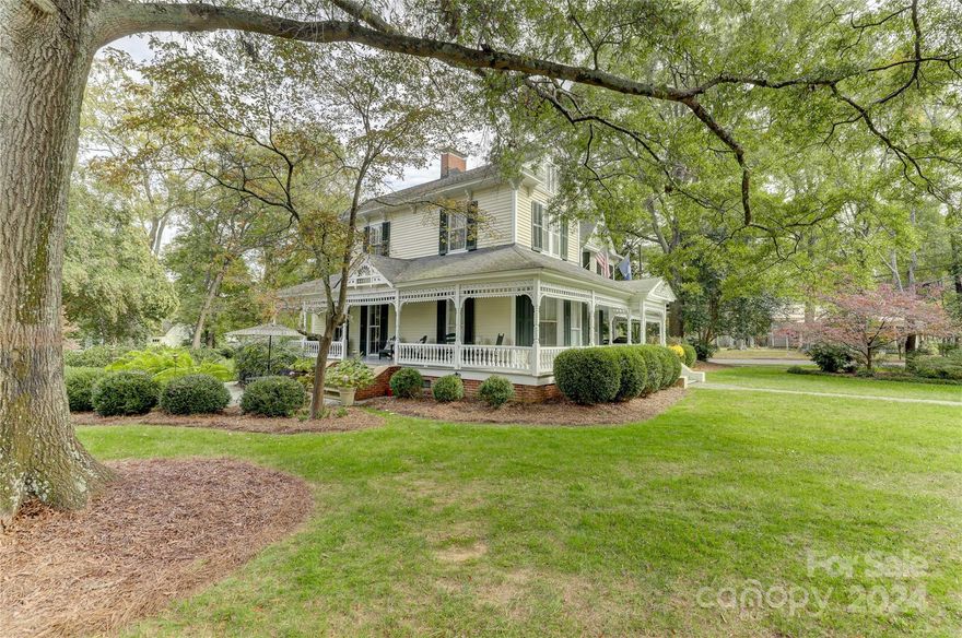 Welcome to Historic York SC to a stunning Victorian Home located at 2 Kings Mtn St. w/in walking distance to quaint shops, restaurants, & festivities.  A slate walkway & patio leads to the Southern Living wrap around porch.  Enter and WOW at the Heart Pine Floors up/down. Beautifully maintained this home is upgraded to the nines & includes a Chef’s Kitchen w/Viking Gas Range/Custom Hood, Granite, huge Pantry & Wet Bar, as well as Spacious Formal rooms for dining/entertaining. Relax by the FP in the Primary w/en-suite located on the main level or stroll up a Winding Staircase to 3 add’l Chamber Rms. & Home Office.  Reconditioned Claw foot Tubs spotlight history as well as 6 Fireplaces (3 up are aesthetic as/is, & 3 down are functioning w/nat. gas) Loaded w/Charm, this historically marked residence offers eccentric  moldings/transoms, tons of natural lighting, solid doors, & antique touches throughout. Tons of parking w/sep. entrance through a mudroom.  A chance to own a part of history!