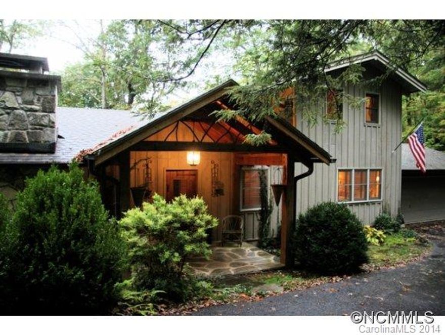 This gracious lakefront home with spectacular view of Lake Toxaway is situated on a large 1.03 +/- acre homesite featuring a massive boulder outcropping. Conveniently located close to the club, this fabulous home features interior bark siding, heart pine floors, open kitchen with concrete countertops and stainless appliances, two wood burning fireplaces, extensive open decks, and remarkable 12 X 35'10" screened porch with stunning lake view.